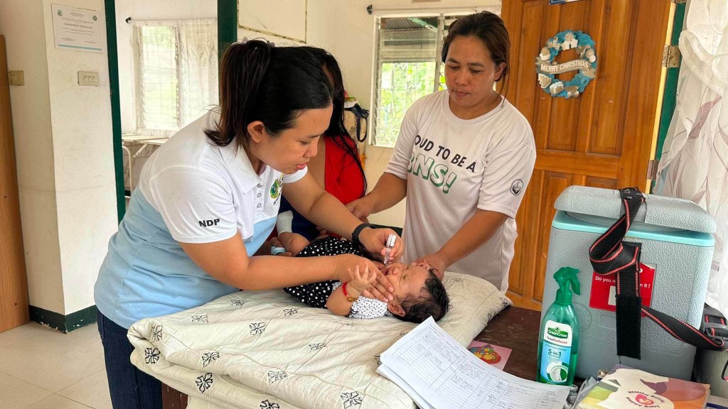Healthcare worker providing infant care at Sapad RHU
